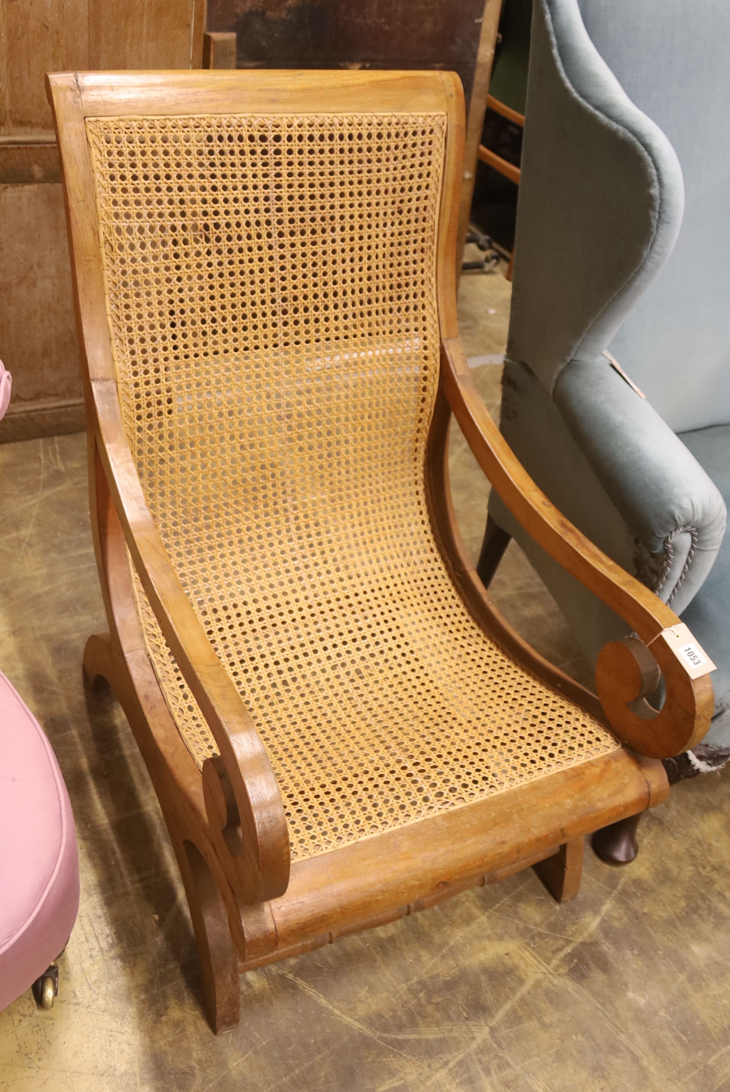 A caned hardwood plantation chair, width 59cm, depth 86cm, height 98cm